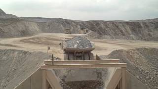 Haul truck dumping into feeder of gyratory crusher [upl. by Ursal]